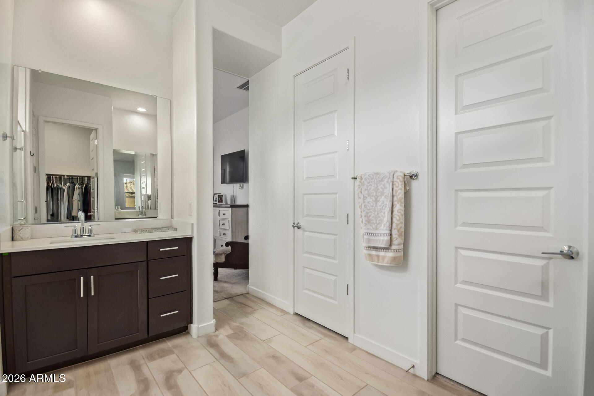 3918 West McNeil Street Laveen, AZ 85339 - Photo 24 of 42 a bathroom with a double vanity sink and mirror