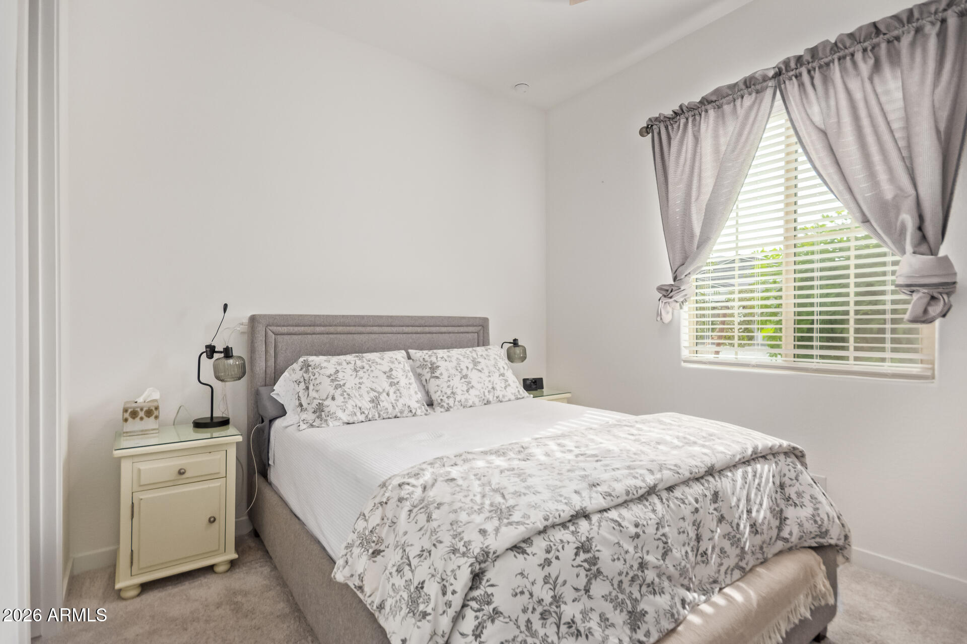 3918 West McNeil Street Laveen, AZ 85339 - Photo 30 of 42 a bedroom with a bed and a window