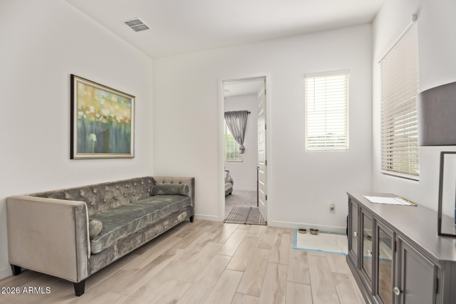 3918 West McNeil Street Laveen, AZ 85339 - Photo 32 of 42 a living room with furniture and a gate