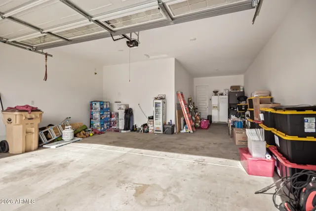 a view of a garage with a bike and car