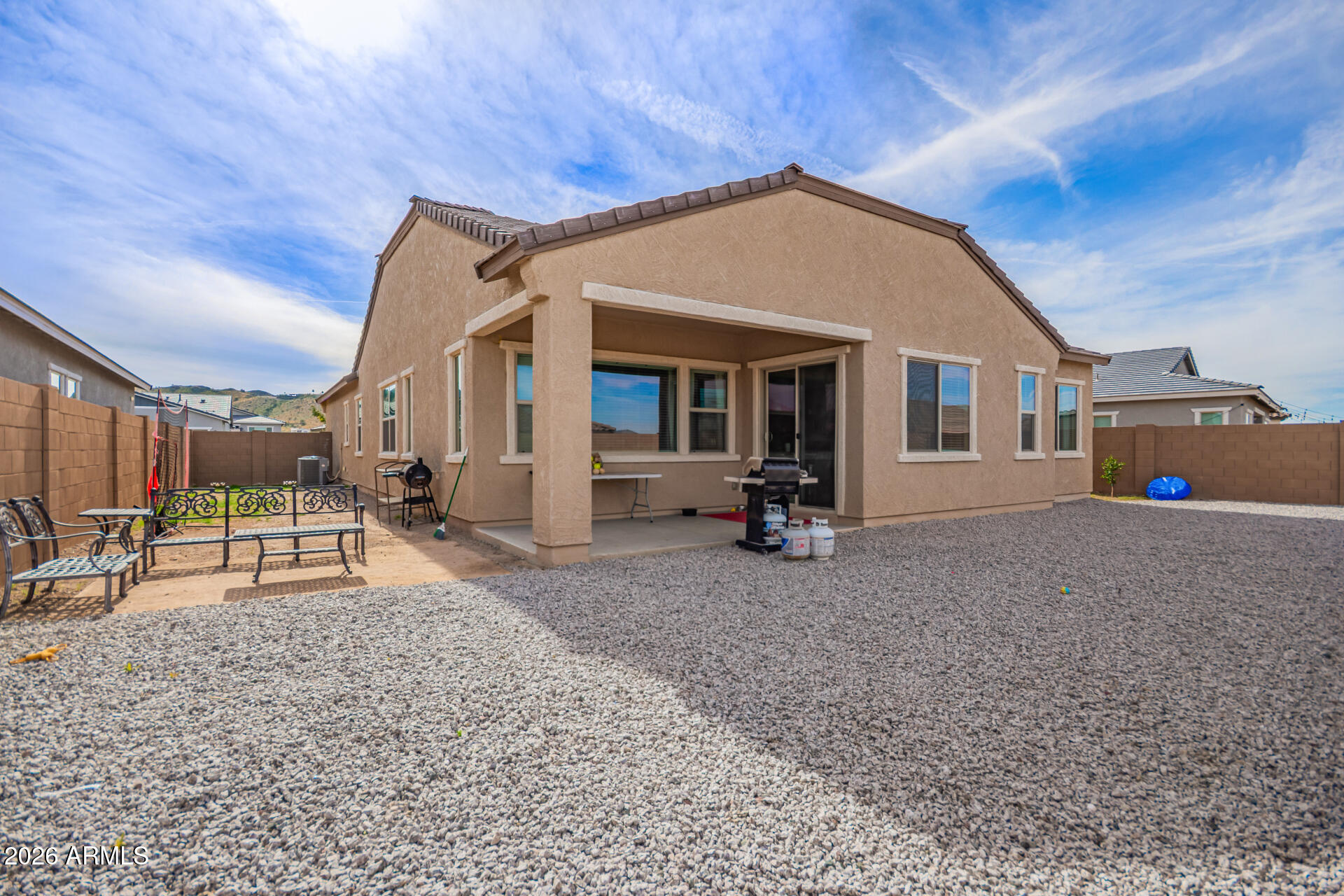 3918 West McNeil Street Laveen, AZ 85339 - Photo 39 of 42 a view of a house with a patio