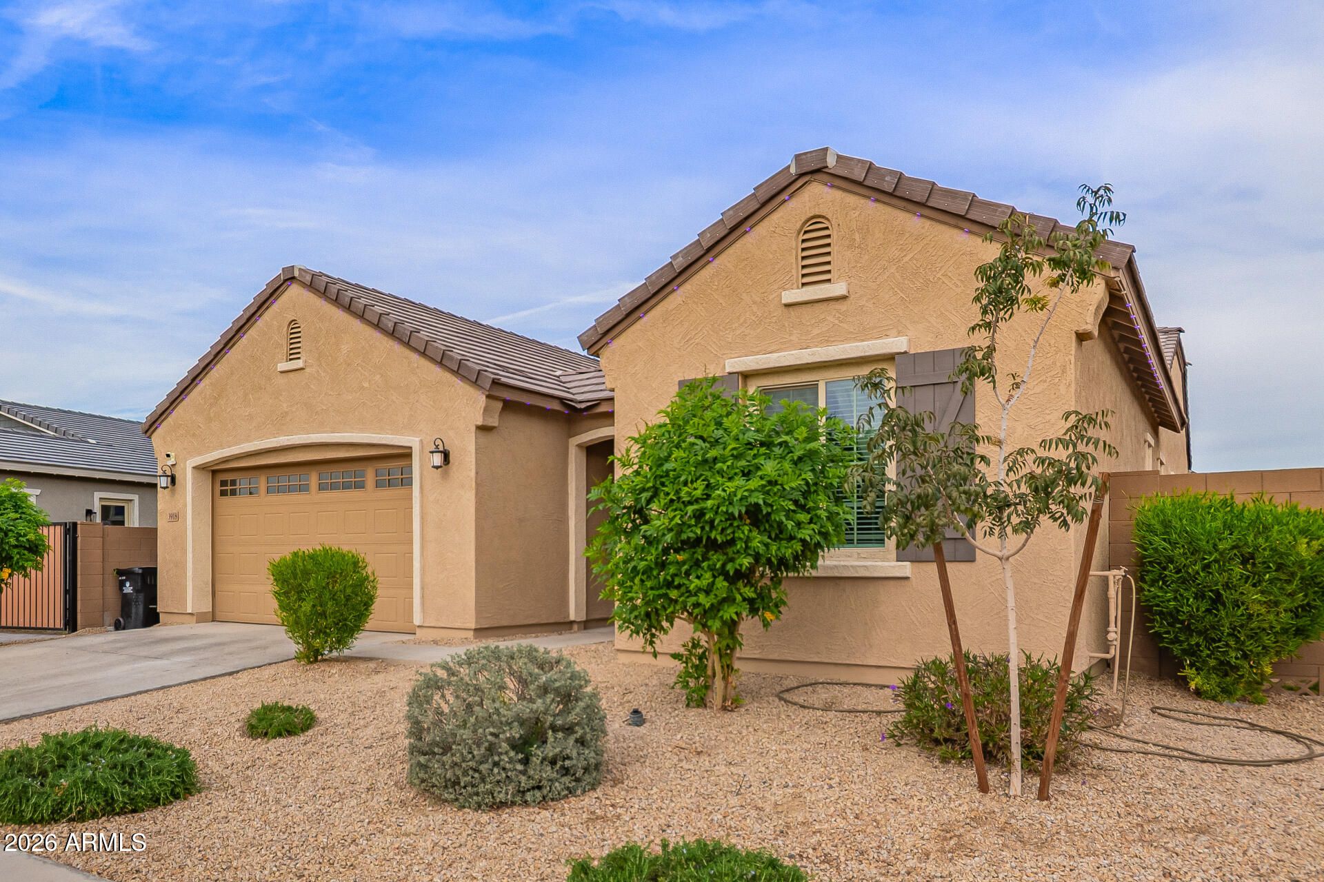 3918 West McNeil Street Laveen, AZ 85339 - Photo 6 of 42 a front view of a house with a yard