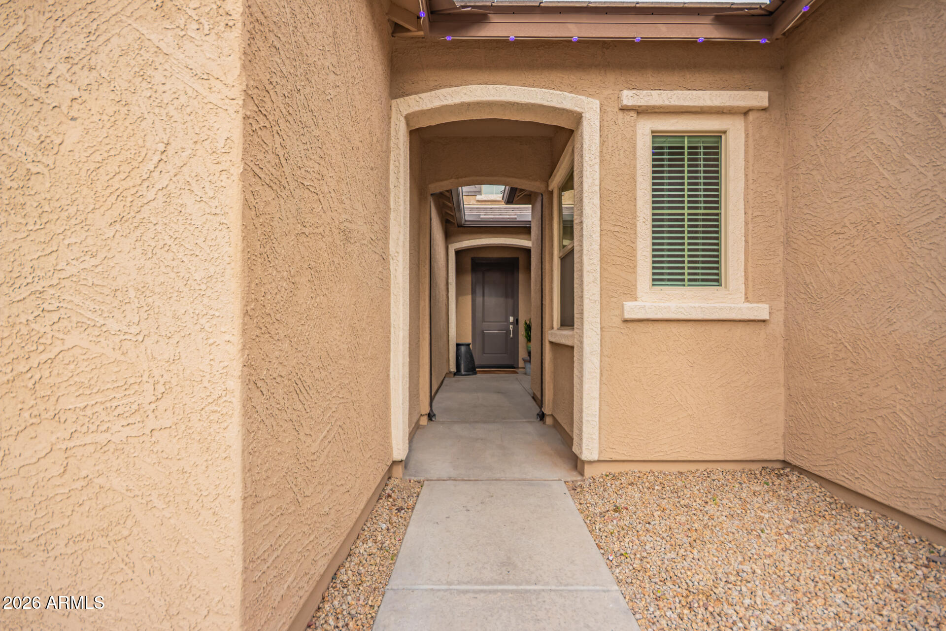 3918 West McNeil Street Laveen, AZ 85339 - Photo 7 of 42 a view of a hallway with wooden floor and a window