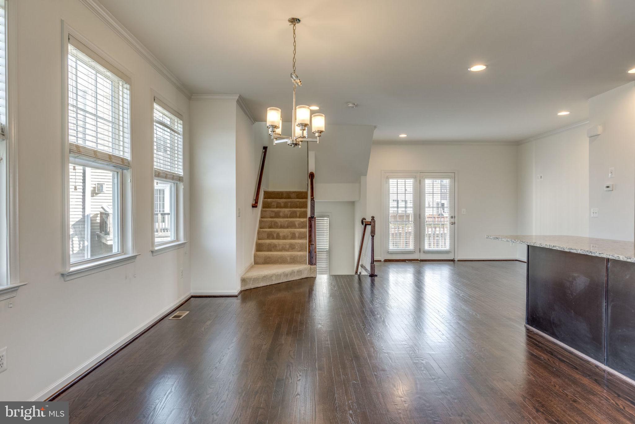 43453 Rickenbacker Square Ashburn, VA 20147 - Photo 2 of 31 Dining area with modern chandelier