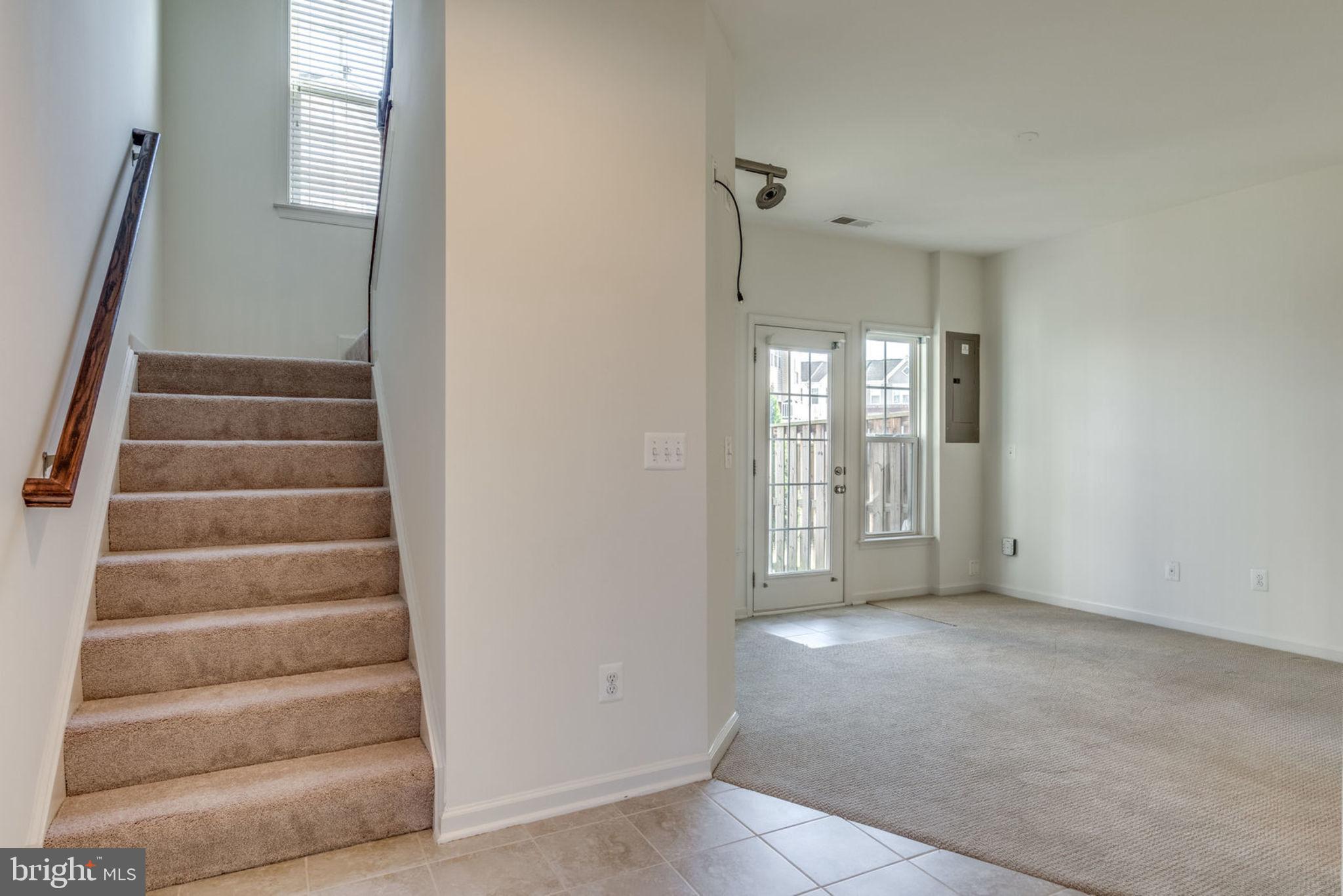 43453 Rickenbacker Square Ashburn, VA 20147 - Photo 4 of 31 Stairs take you up to the main living area