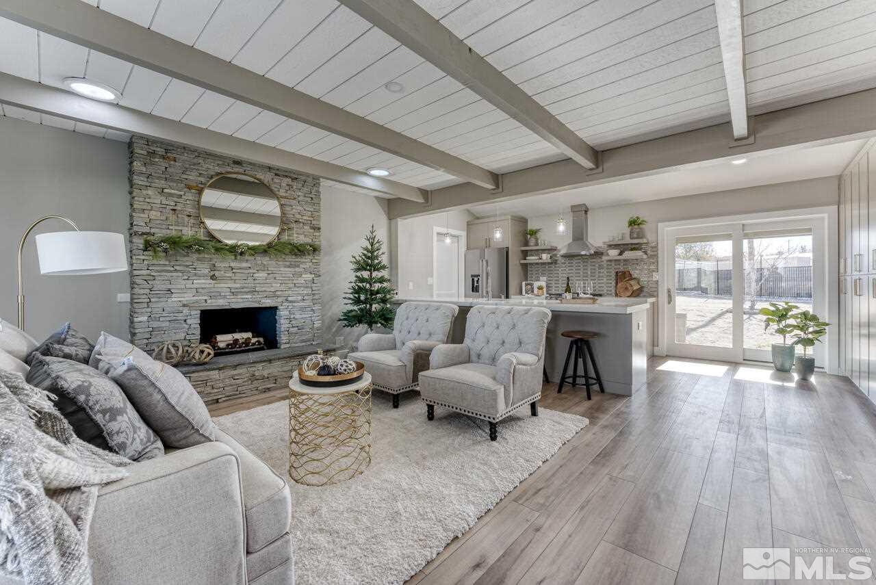 1025 Foothill Road Reno, NV 89511 - Photo 11 of 40 a living room with furniture and a fireplace