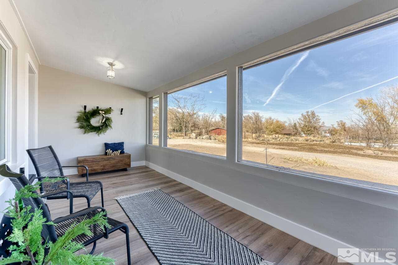 1025 Foothill Road Reno, NV 89511 - Photo 4 of 40 a living room with furniture and a large window