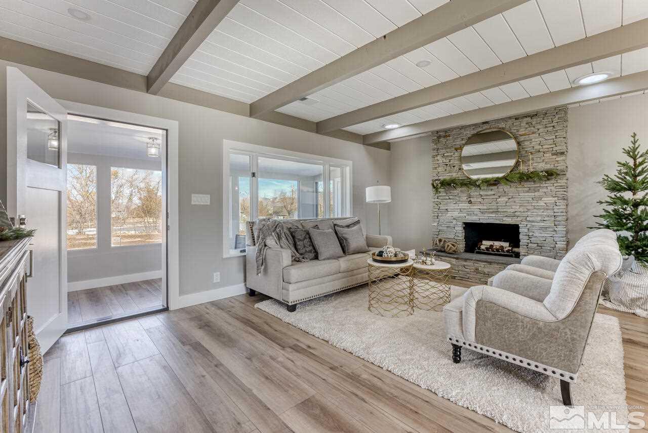 1025 Foothill Road Reno, NV 89511 - Photo 6 of 40 a living room with furniture and a fireplace