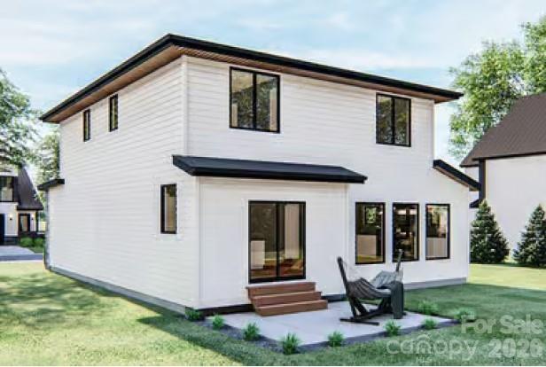 313 Iron Ridge Loop, Unit 16 Asheville, NC 28806 - Photo 4 of 9 a front view of a house with garden