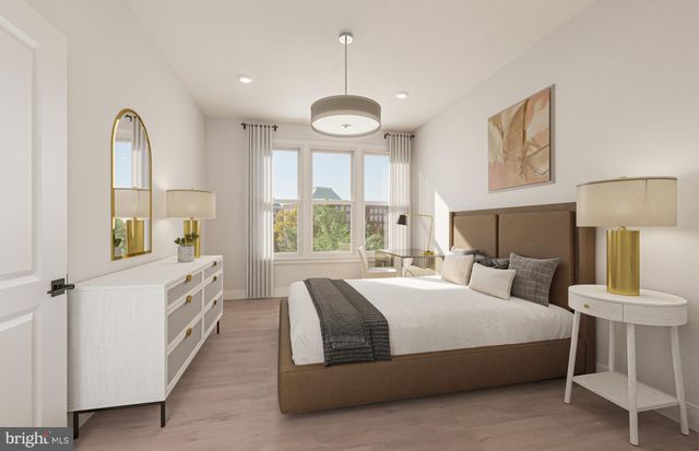 a view of walk in closet with clothes