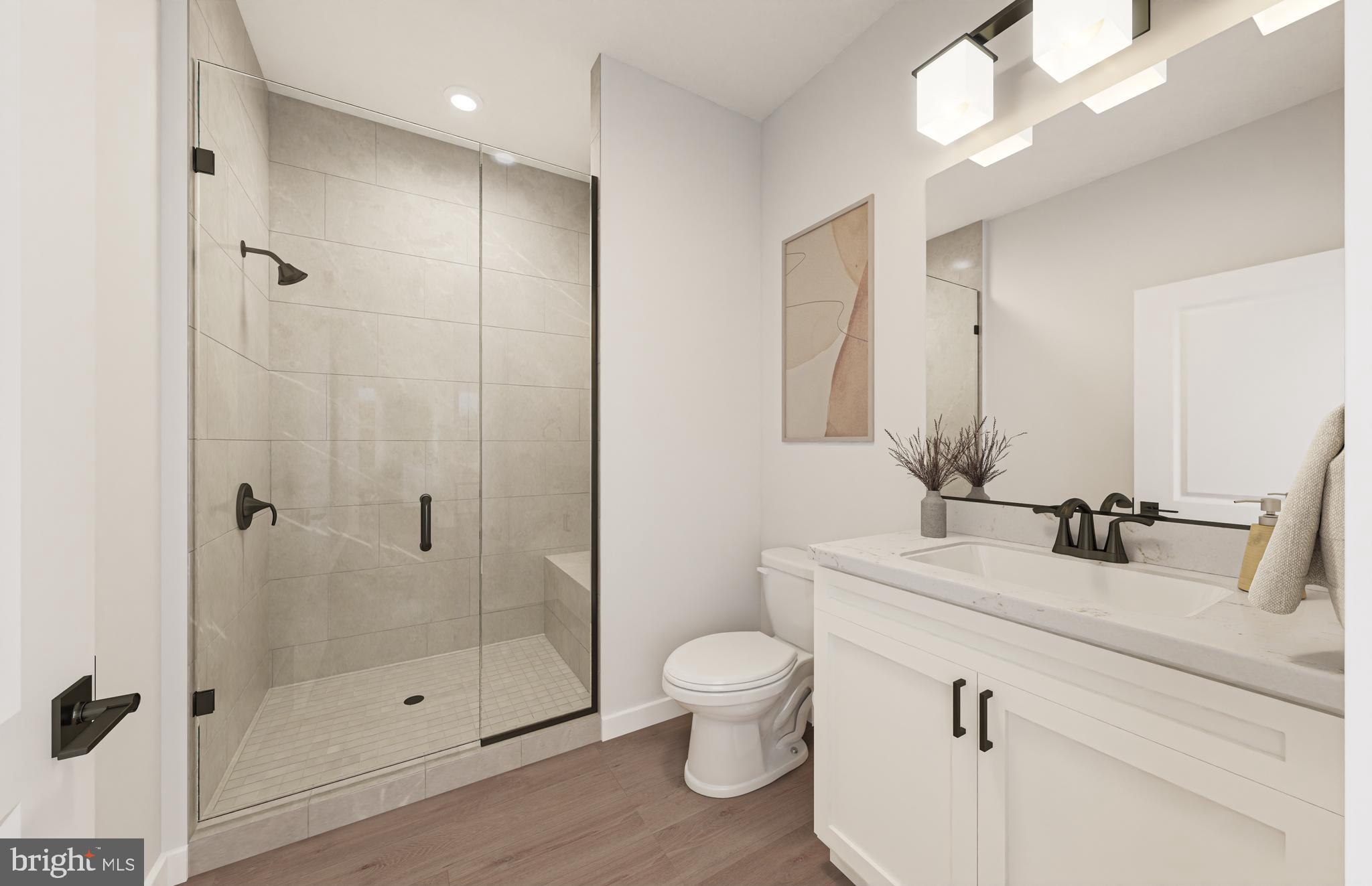 1141 Fortune Terrace, Unit 401 Potomac, MD 20854 - Photo 12 of 14 a bathroom with a shower sink vanity mirror and toilet