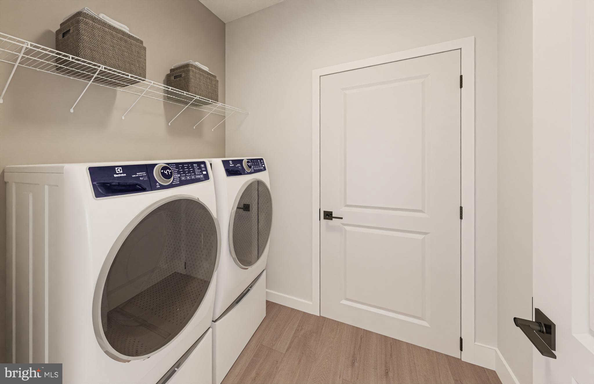 1141 Fortune Terrace, Unit 401 Potomac, MD 20854 - Photo 13 of 14 a utility room with dryer and washer