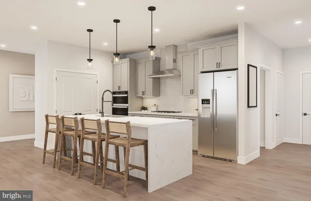 a view of a living room with furniture and a hallway