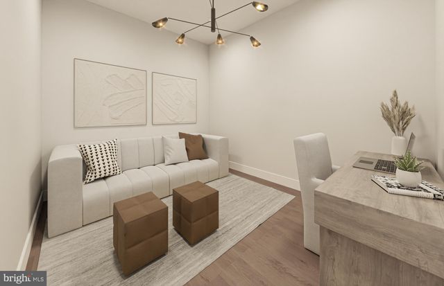 a living room with furniture a flat screen tv and a large window