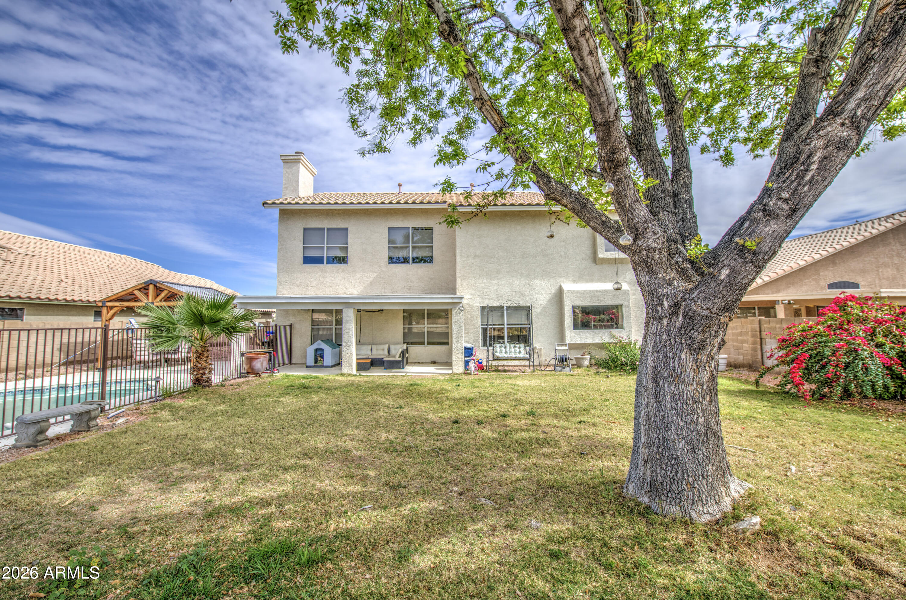 12403 West Monte Vista Road Avondale, AZ 85392 - Photo 58 of 63 a front view of a house with a garden