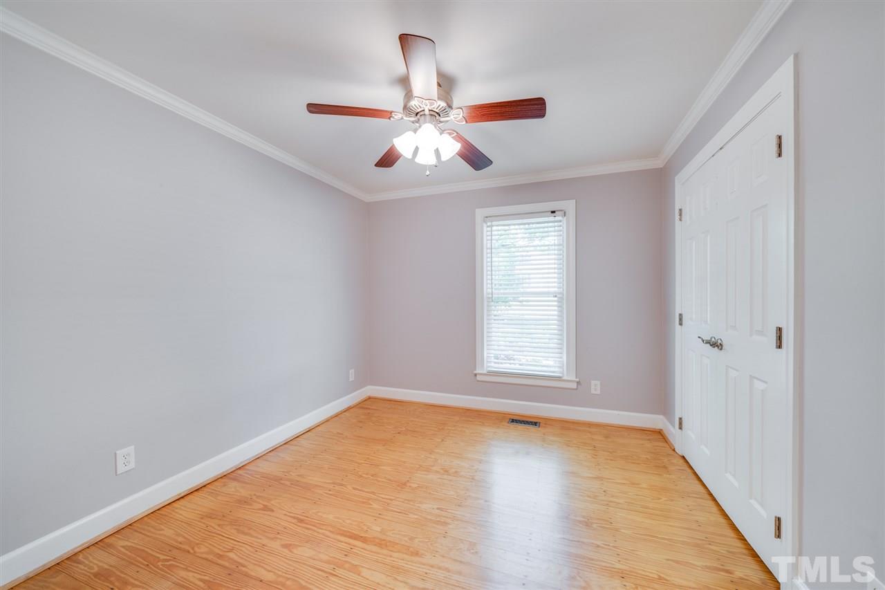 2116 Quail Ridge Road Raleigh, NC 27609 - Photo 15 of 30 an empty room with windows and fan
