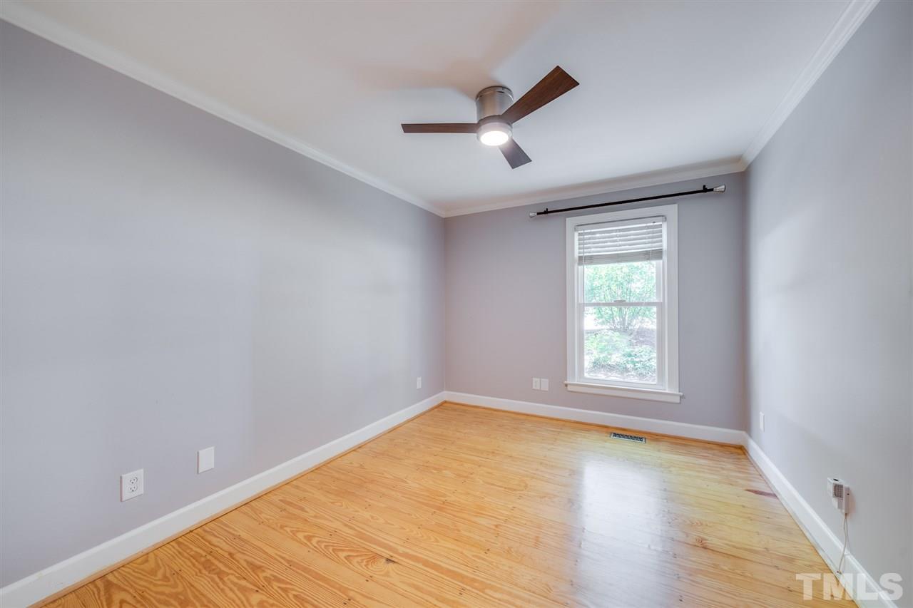 2116 Quail Ridge Road Raleigh, NC 27609 - Photo 17 of 30 wooden floor in an empty room with a window