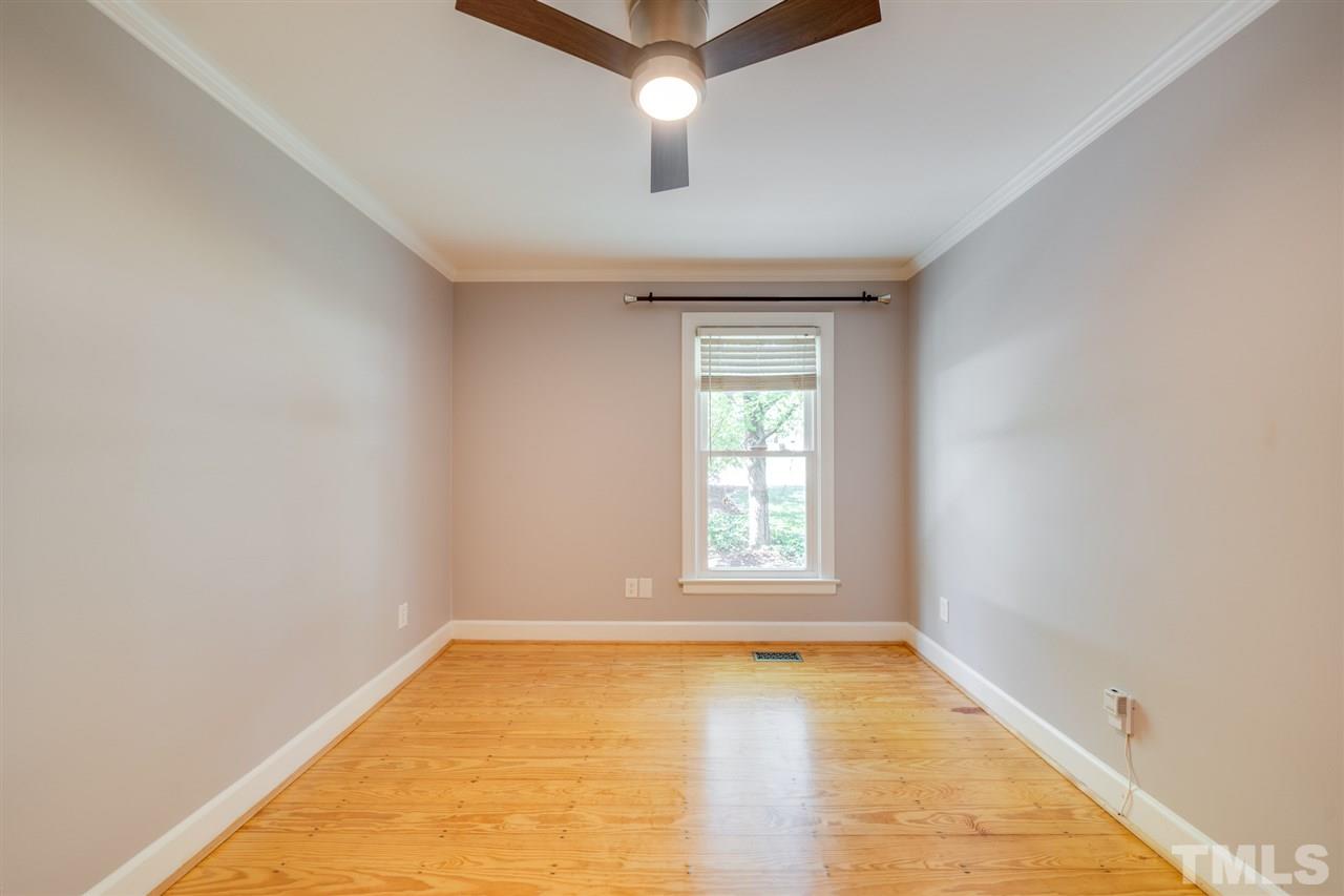 2116 Quail Ridge Road Raleigh, NC 27609 - Photo 18 of 30 wooden floor in an empty room with a window