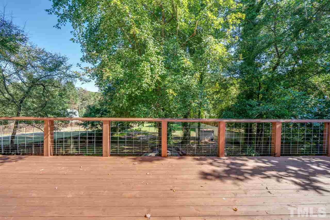 2116 Quail Ridge Road Raleigh, NC 27609 - Photo 22 of 30 a view of a house with a wooden fence