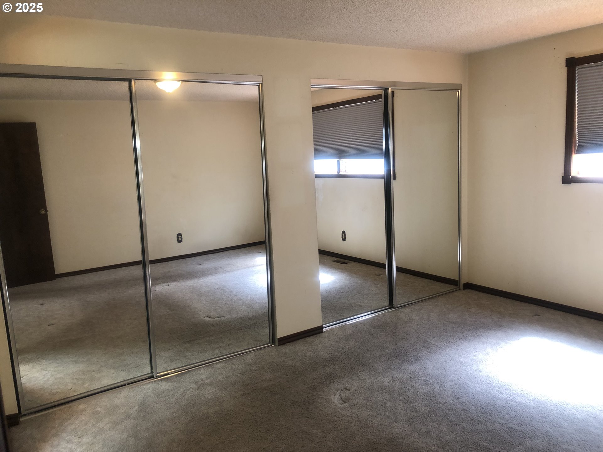 1179 Southeast Maple Place Gresham, OR 97080 - Photo 14 of 14 a view of an empty room with window and wooden floor
