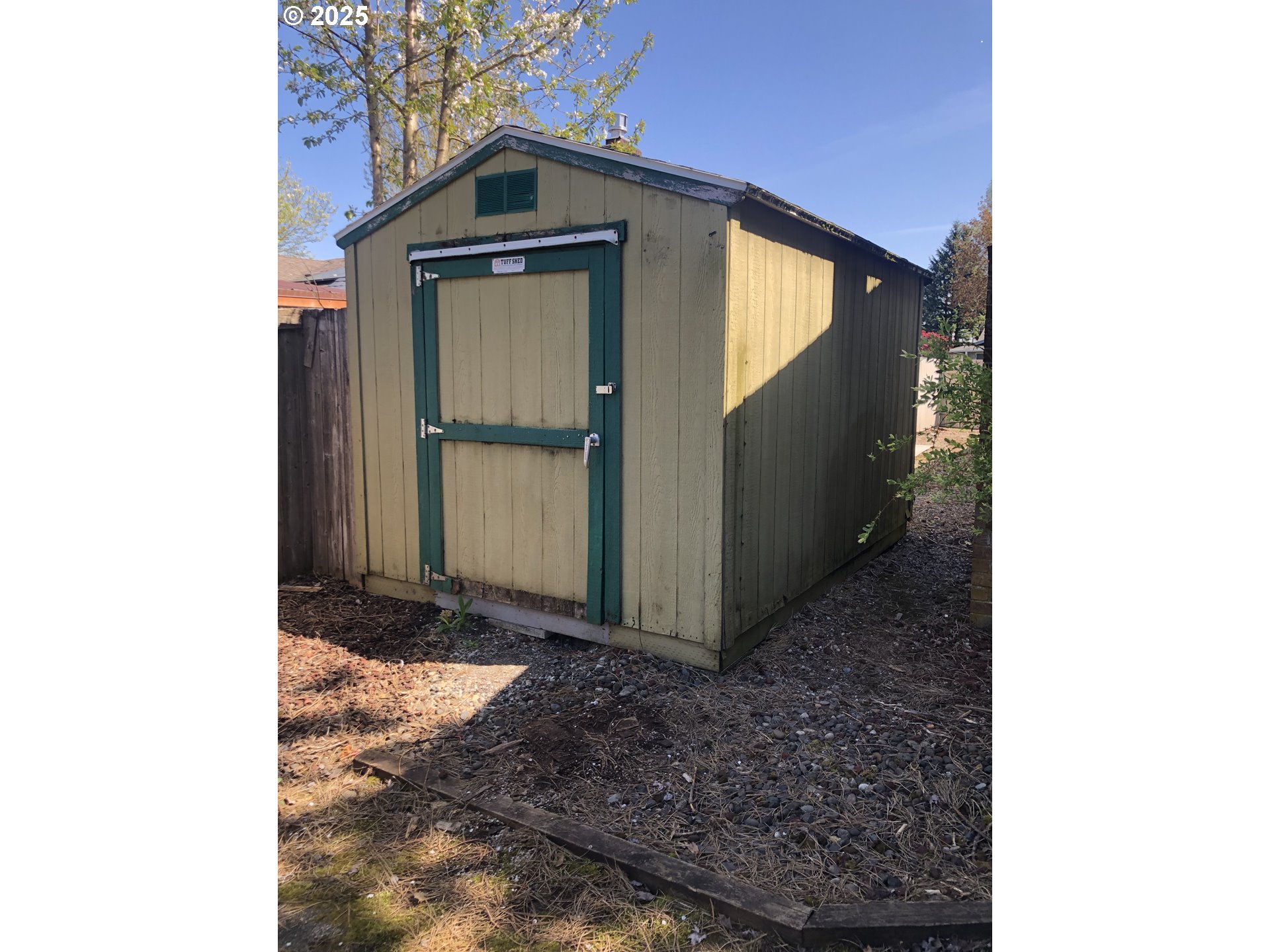 1179 Southeast Maple Place Gresham, OR 97080 - Photo 3 of 14 a view of a house with a door and a large window