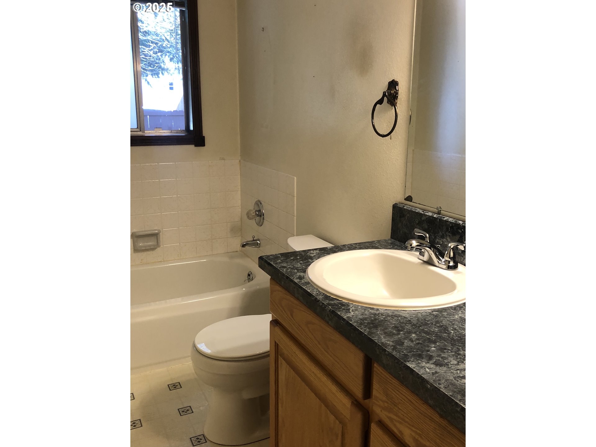 1179 Southeast Maple Place Gresham, OR 97080 - Photo 7 of 14 a bathroom with a granite countertop sink a toilet and a bathtub