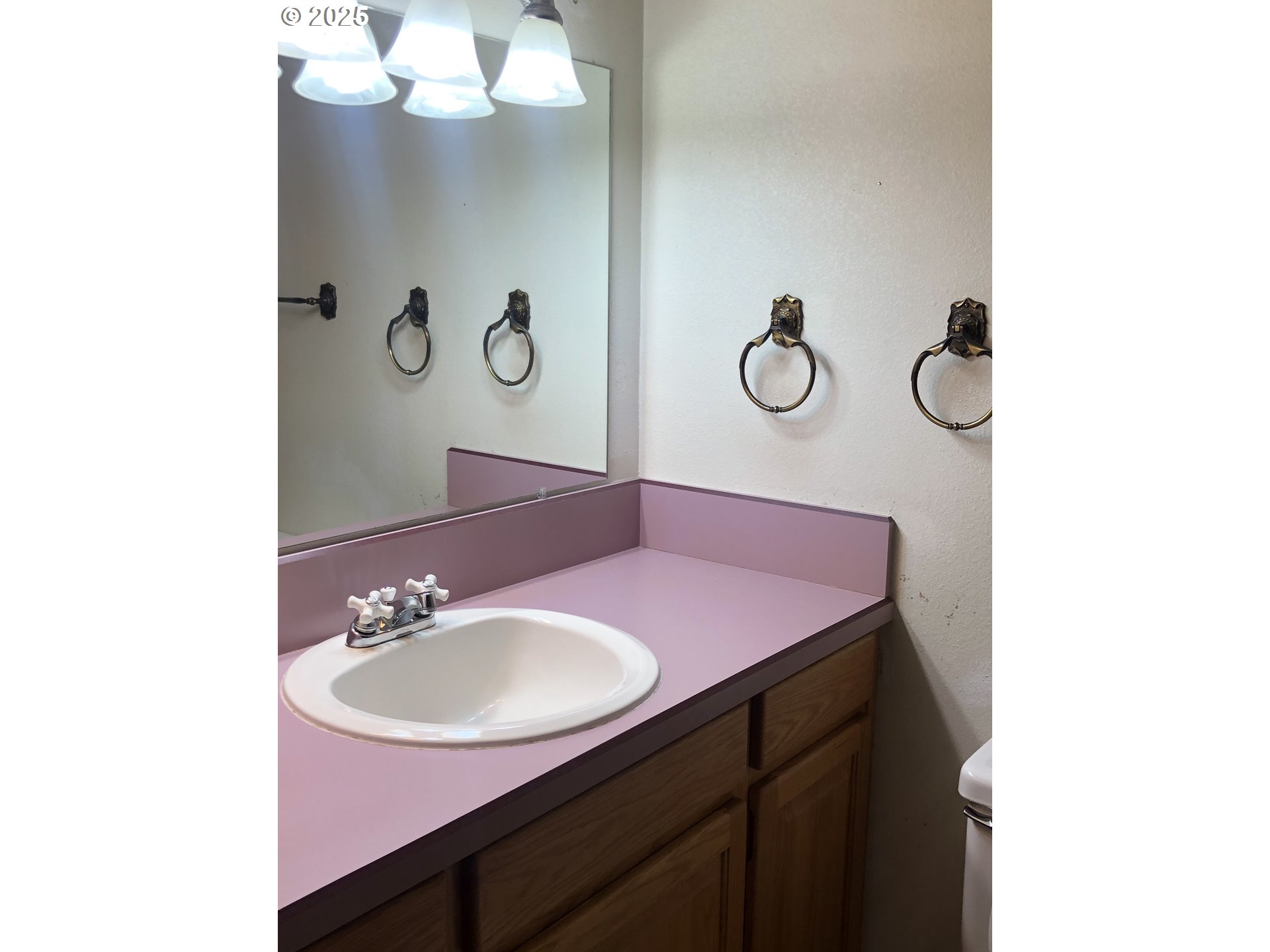 1179 Southeast Maple Place Gresham, OR 97080 - Photo 10 of 14 a bathroom with a sink vanity and mirror