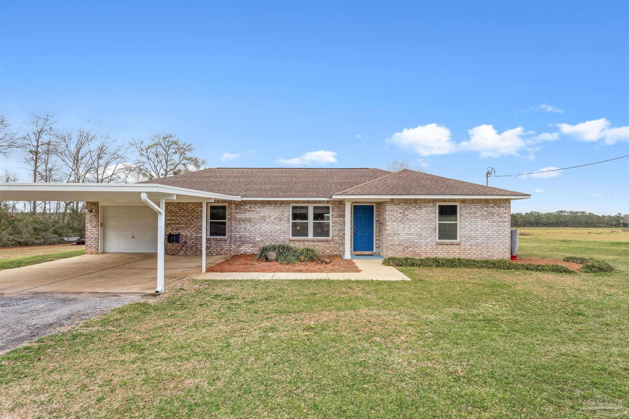1911 Ard Field Road Jay, FL 32565 - Photo 1 of 47 a house view with a garden space