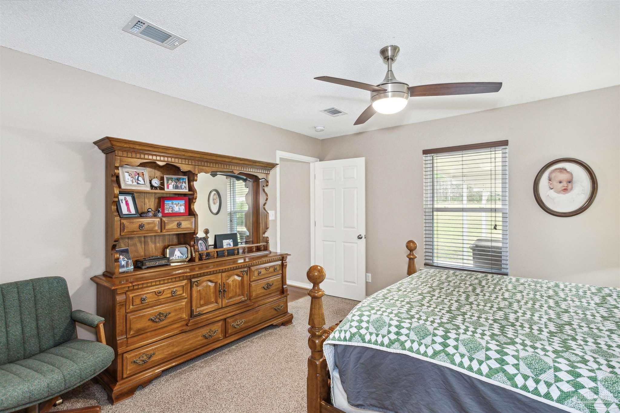 1911 Ard Field Road Jay, FL 32565 - Photo 18 of 47 a bedroom with furniture and a window