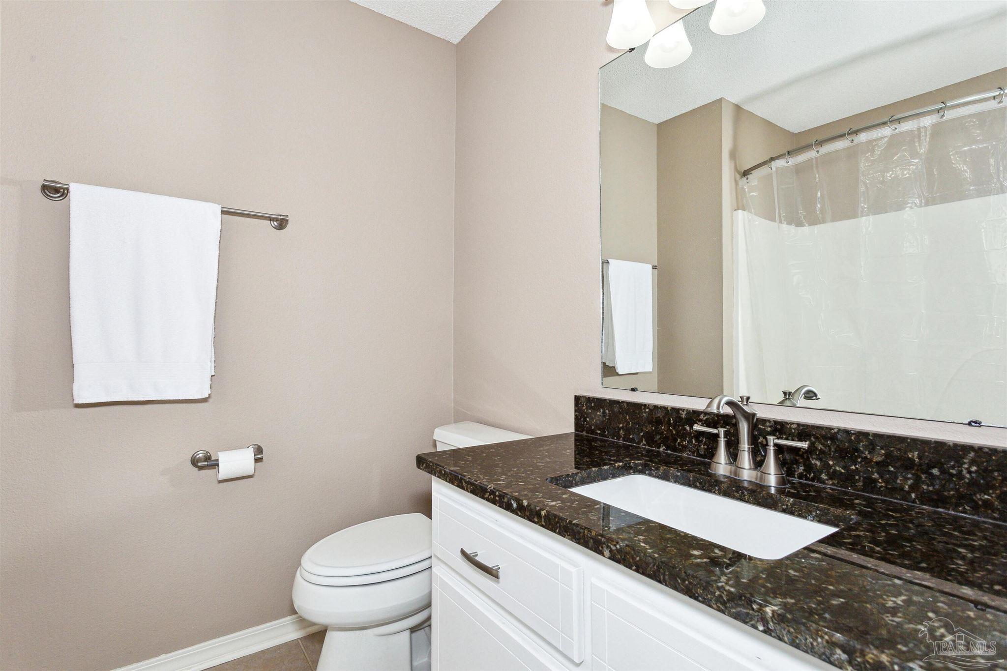 1911 Ard Field Road Jay, FL 32565 - Photo 19 of 47 a bathroom with a granite countertop sink and a mirror