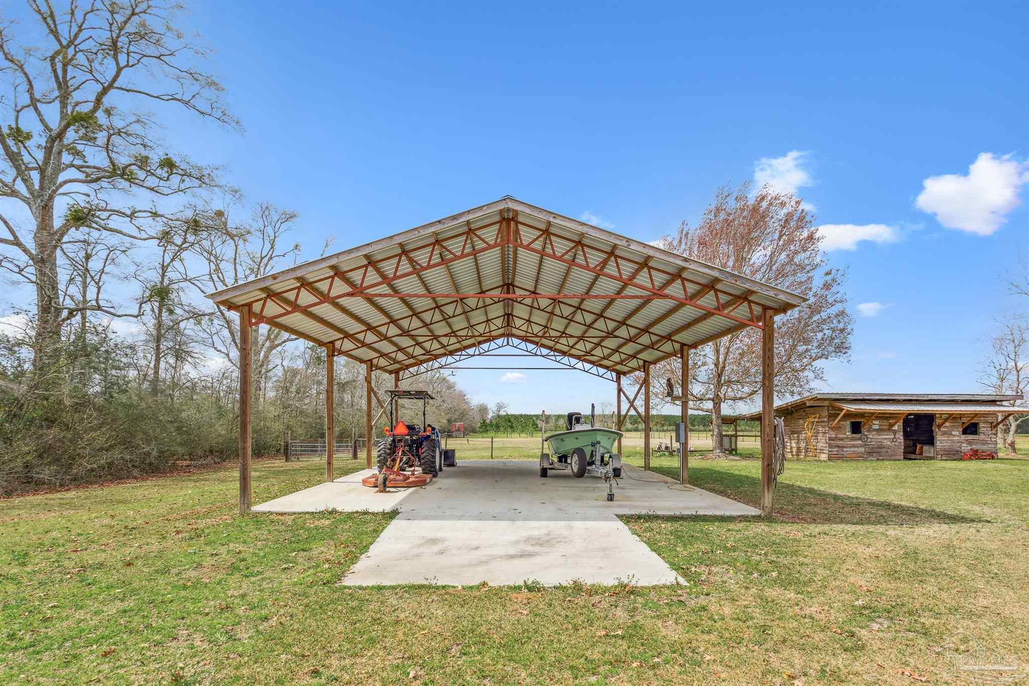 1911 Ard Field Road Jay, FL 32565 - Photo 32 of 47 a view of a building with a yard