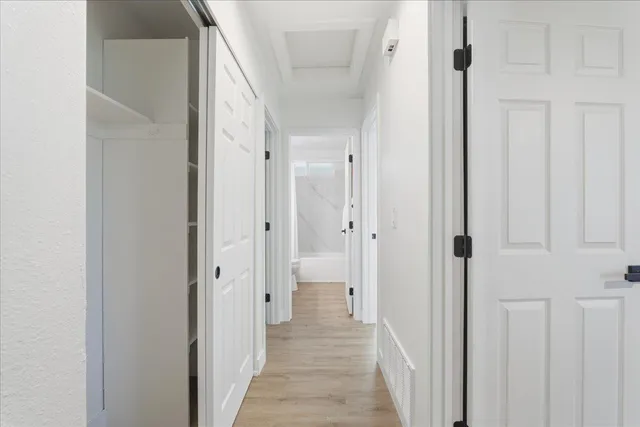a view of a bathroom from the hallway