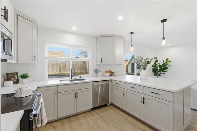 a kitchen with a sink and cabinets