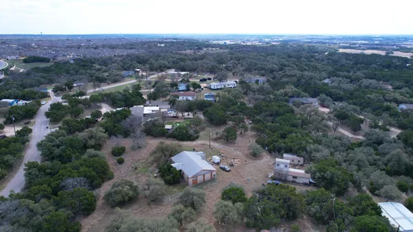 an aerial view of a city with lots of residential buildings