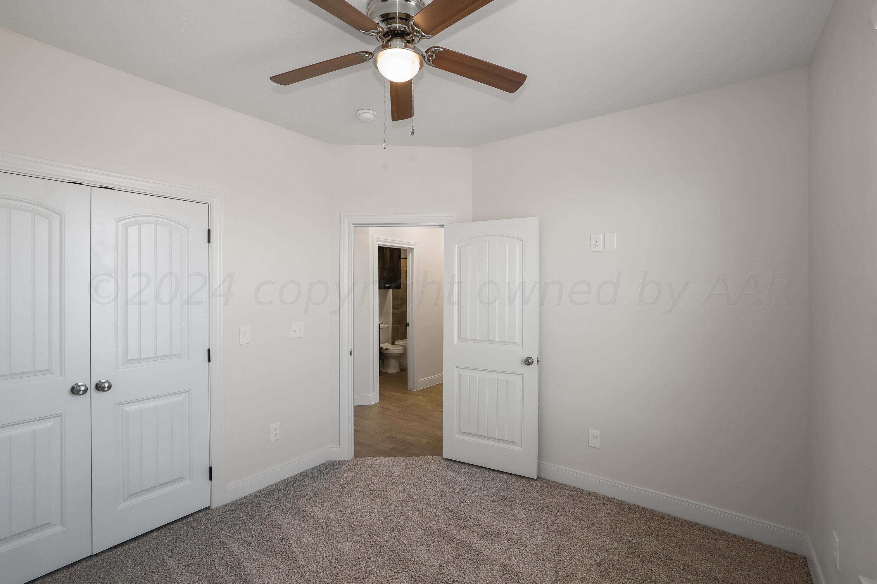 50 South Fm 2381 Amarillo, TX 79124 - Photo 17 of 31 an empty room with closet and a ceiling fan
