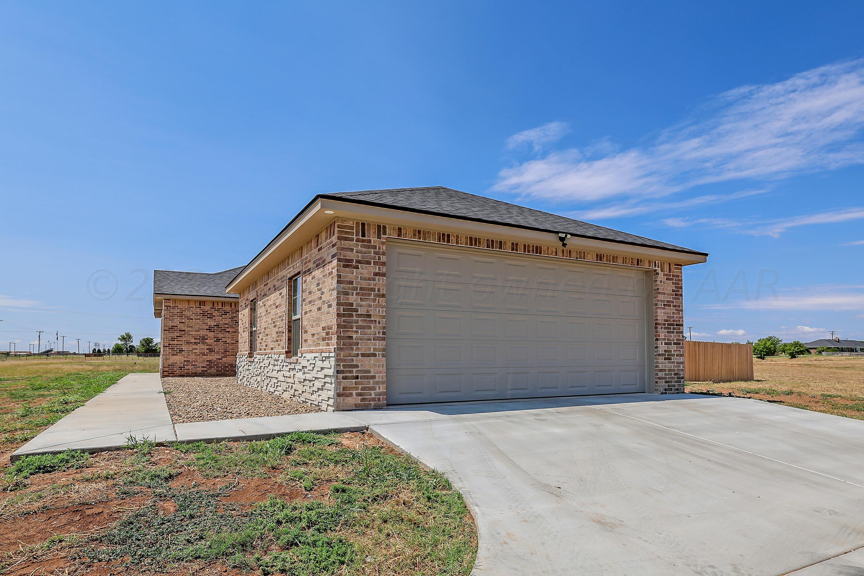 50 South Fm 2381 Amarillo, TX 79124 - Photo 3 of 31 a front view of a house with a yard