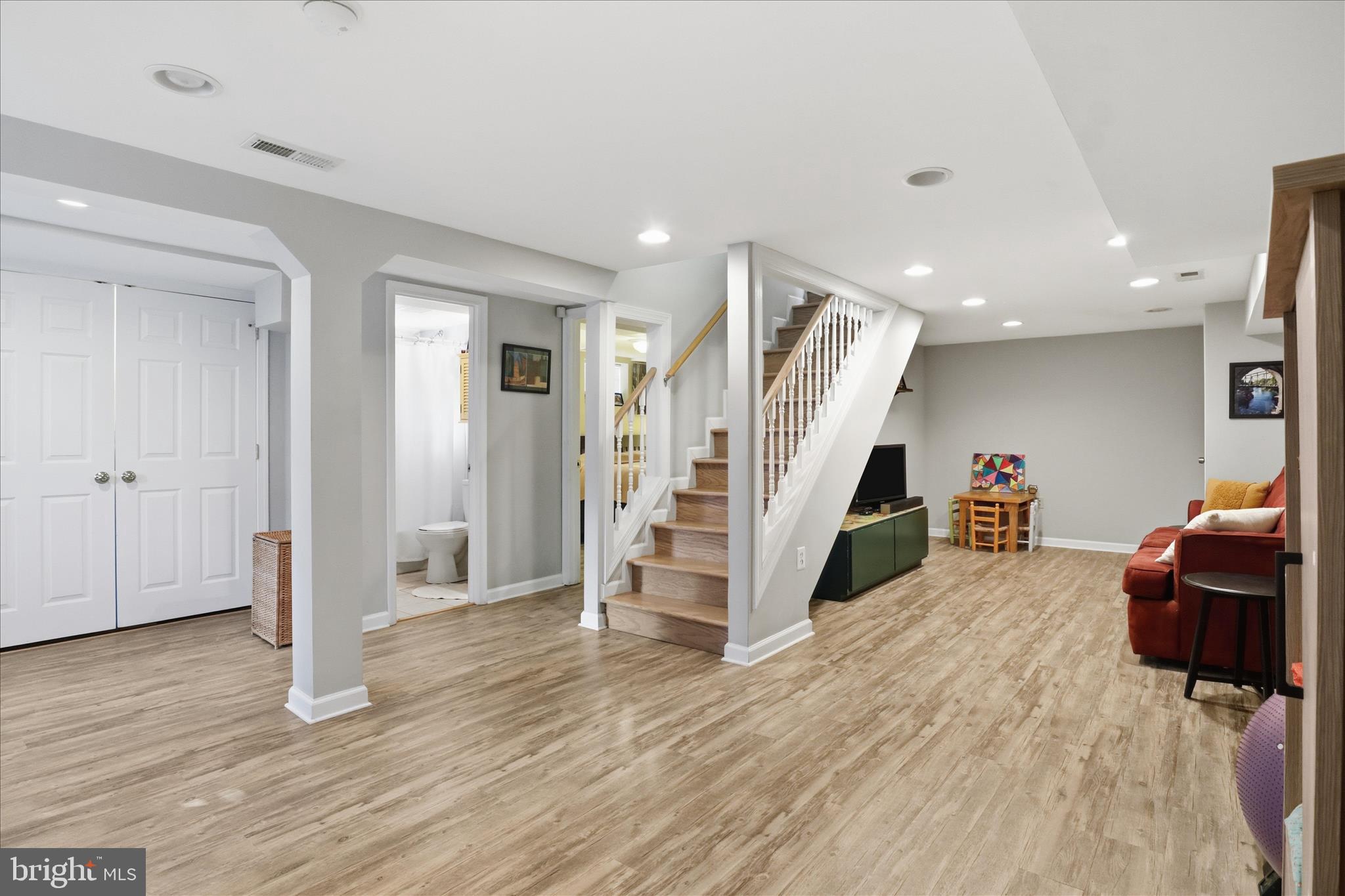 304 Highview Avenue Silver Spring, MD 20901 - Photo 24 of 48 a view of a livingroom with wooden floor and furniture