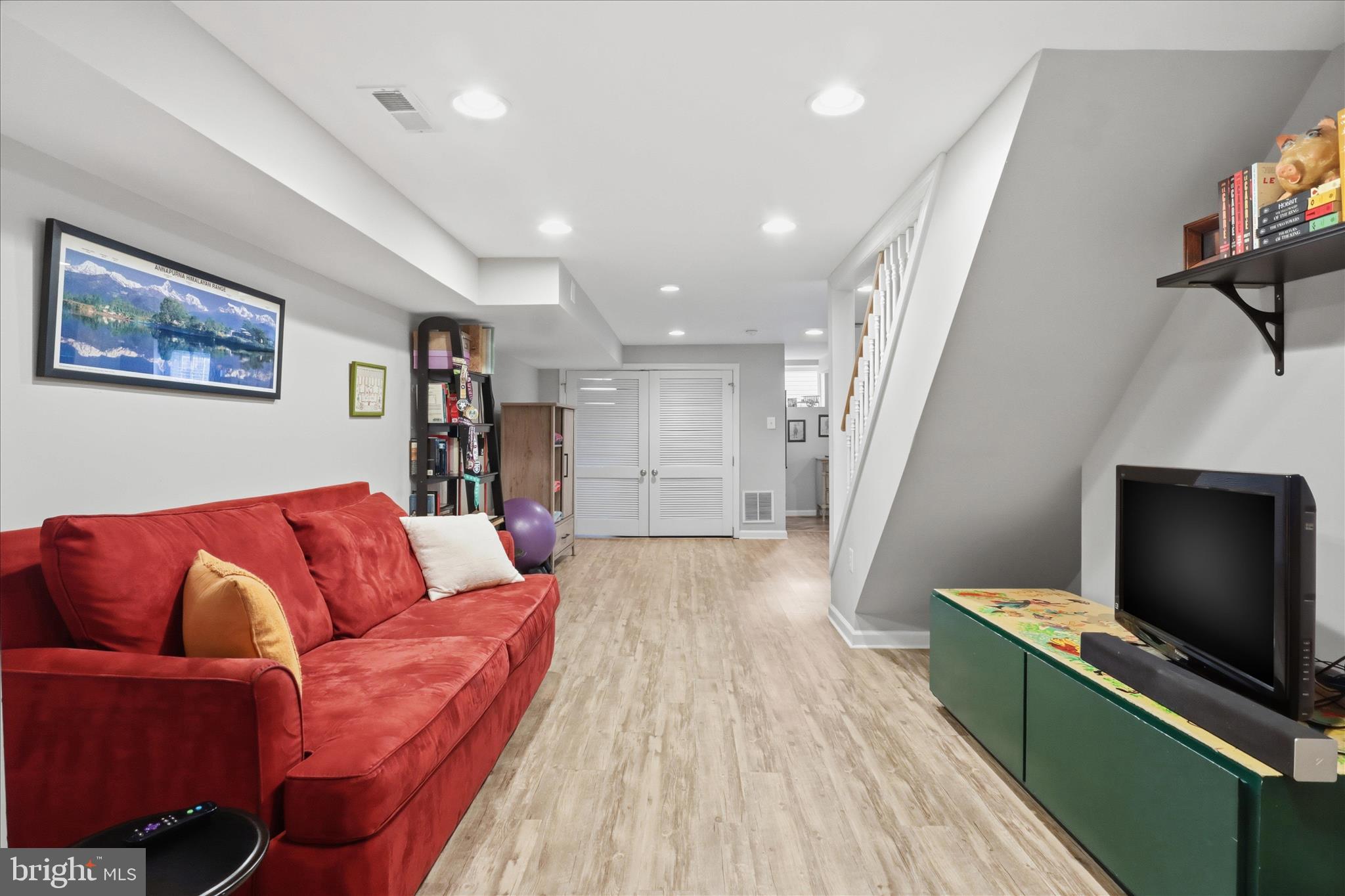 304 Highview Avenue Silver Spring, MD 20901 - Photo 27 of 48 a living room with furniture and a flat screen tv