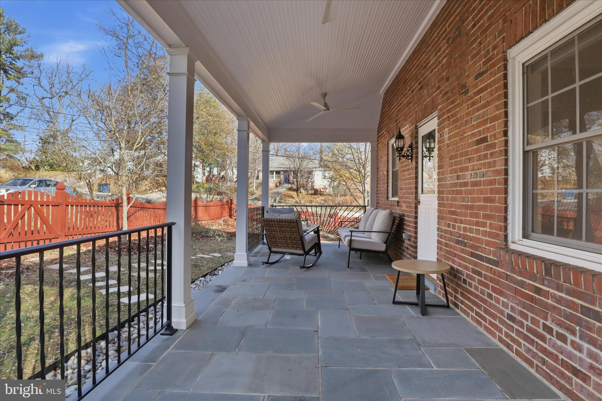304 Highview Avenue Silver Spring, MD 20901 - Photo 33 of 48 a view of a porch with chairs and floor to ceiling window