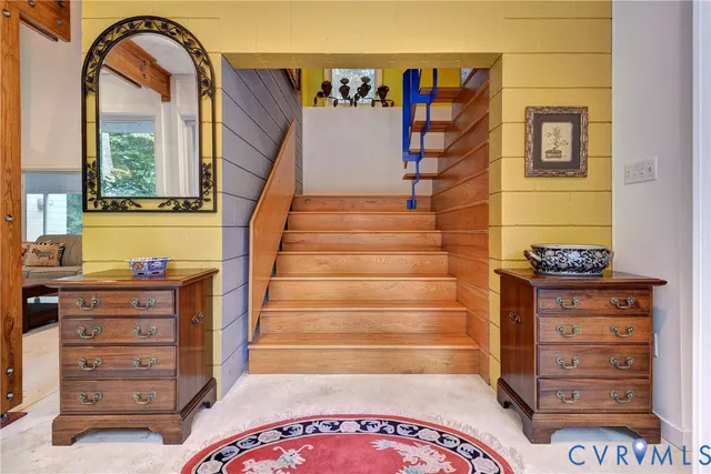 a view of walk in closet with clothes