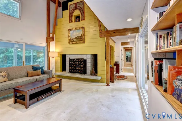 a living room with fireplace furniture and a fireplace