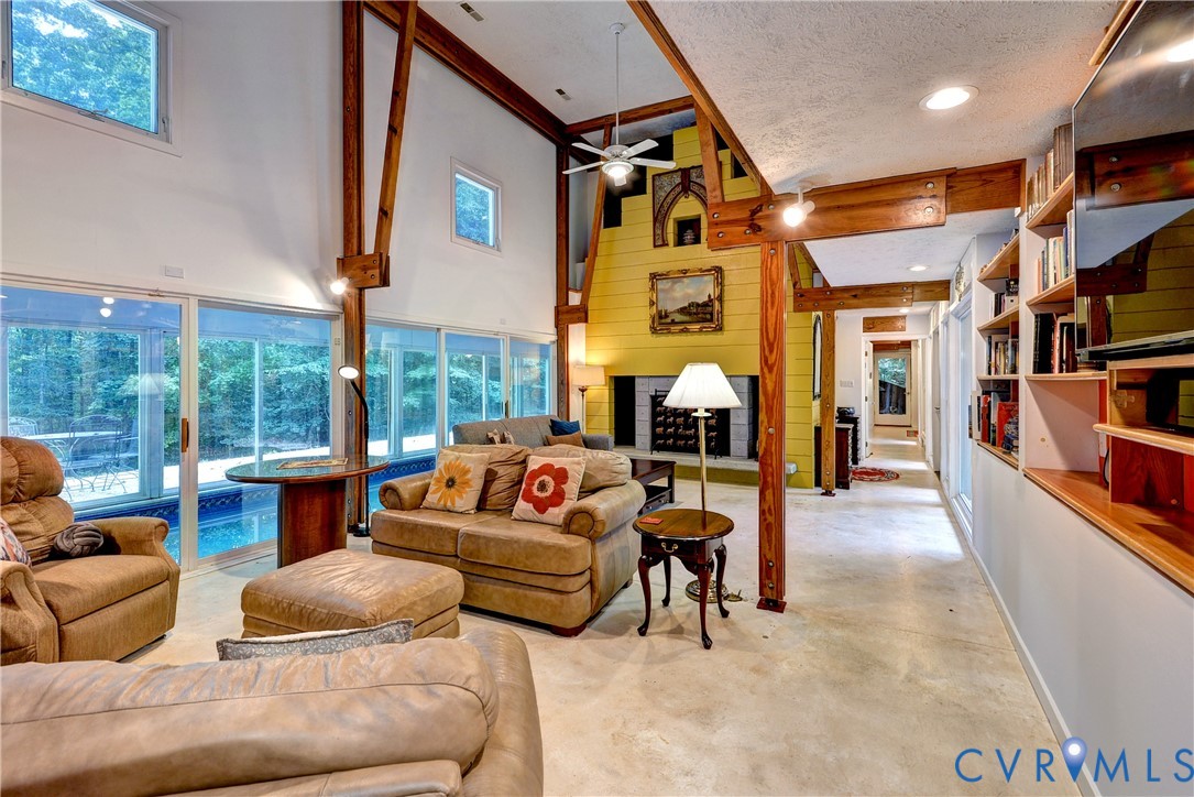 8615 Historical Path Road New Kent, VA 23124 - Photo 16 of 50 a living room with furniture a rug and a large window