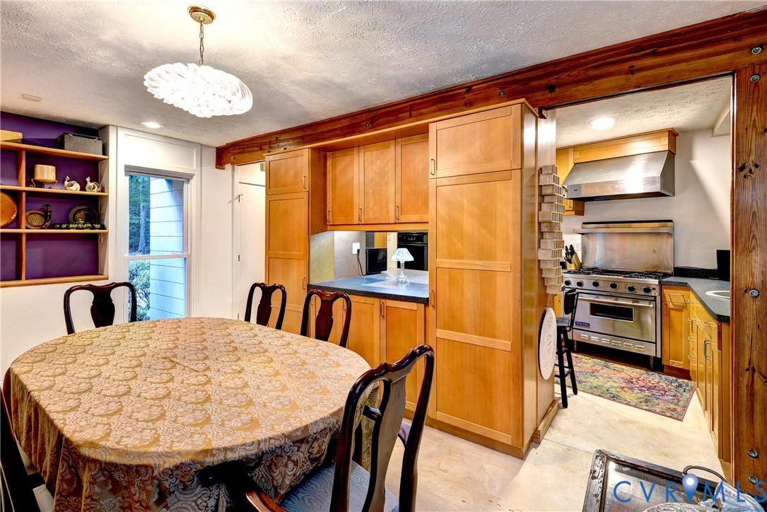 8615 Historical Path Road New Kent, VA 23124 - Photo 22 of 50 a view of a dining room with furniture window and wooden floor