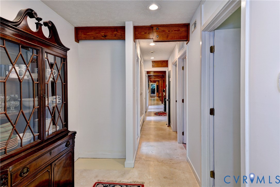 8615 Historical Path Road New Kent, VA 23124 - Photo 24 of 50 a view of a hallway with wooden shelves
