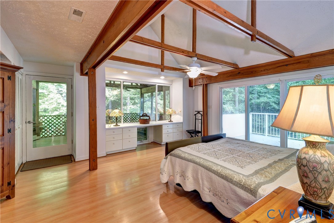8615 Historical Path Road New Kent, VA 23124 - Photo 39 of 50 a living room with furniture a large window with wooden floor