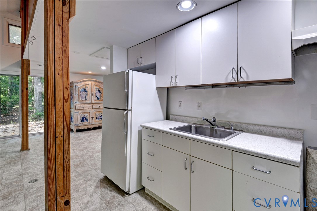 8615 Historical Path Road New Kent, VA 23124 - Photo 48 of 50 a kitchen with a refrigerator and cabinets