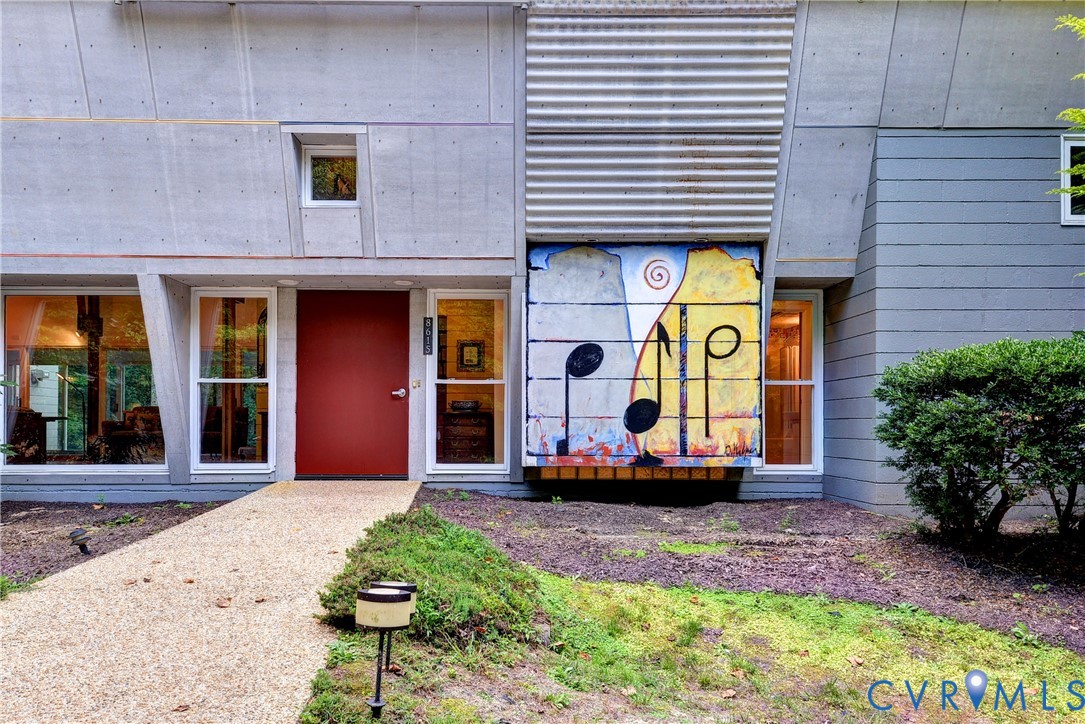 8615 Historical Path Road New Kent, VA 23124 - Photo 9 of 50 a view of a brick building with many windows