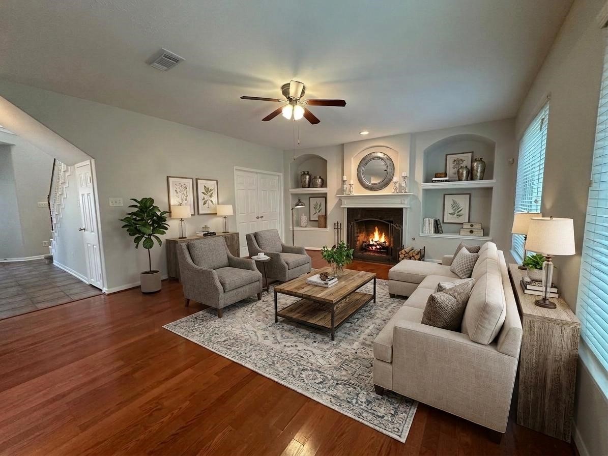 9210 Memorial Grove Drive Spring, TX 77379 - Photo 8 of 33 a living room with furniture fireplace and wooden floor