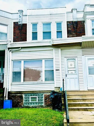 a view of a house with a window and balcony