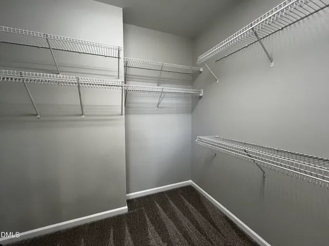 a view of a room with racks on the wall